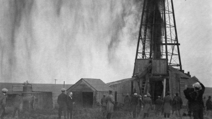 Workers strike oil in Osage territory. (Credit: David Grann)