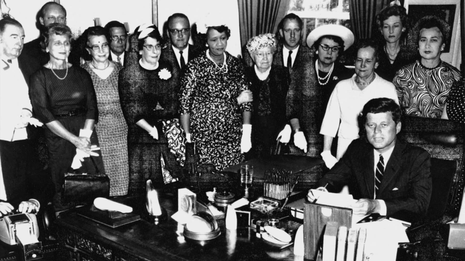 US-WHITE HOUSE-KENNEDY Standing behind President John F. Kennedy (Seated-R) signing the Equal Pay Act on 10 June 1963 from (R-L) are: Congresswoman Edna Kelly, Congresswoman Edith Green, an unidentified woman, Mary Anderson, Women's Bureau Director, and Dr. Dorothy Height, President National Council of Negro Women. Other organizations represented at this event included the National Council of Catholic Women, the National Council of Jewish Women, the United Auto Workers, and the National Federation of Business and Professional Women's Clubs. AFP PHOTO/HO (Photo by - / John F. Kennedy Library Foundation / AFP) (Photo by -/John F. Kennedy Library Foundati/AFP via Getty Images)