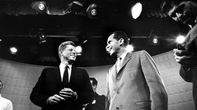 John F. Kennedy and Richard Nixon exchanging smiles prior to beginning their 1st TV debate. (Credit: Paul Schutzer/The LIFE Picture Collection/Getty Images)