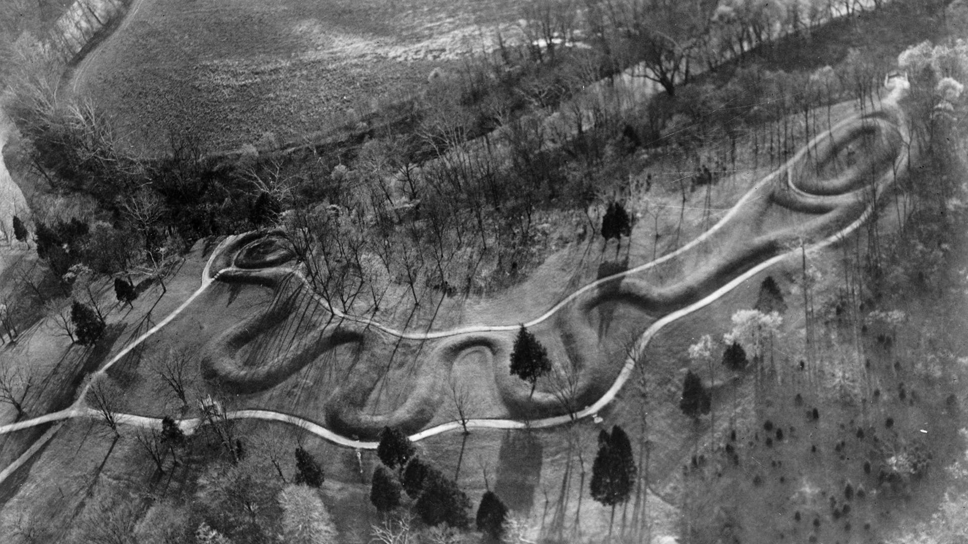 The Great Serpent Mound in Adams County, Ohio, built by the Adena people between 800 BC and AD 400. This protected historical earthworks is nearly a quarter of a mile long and represents a giant snake holding an egg in its jaws.