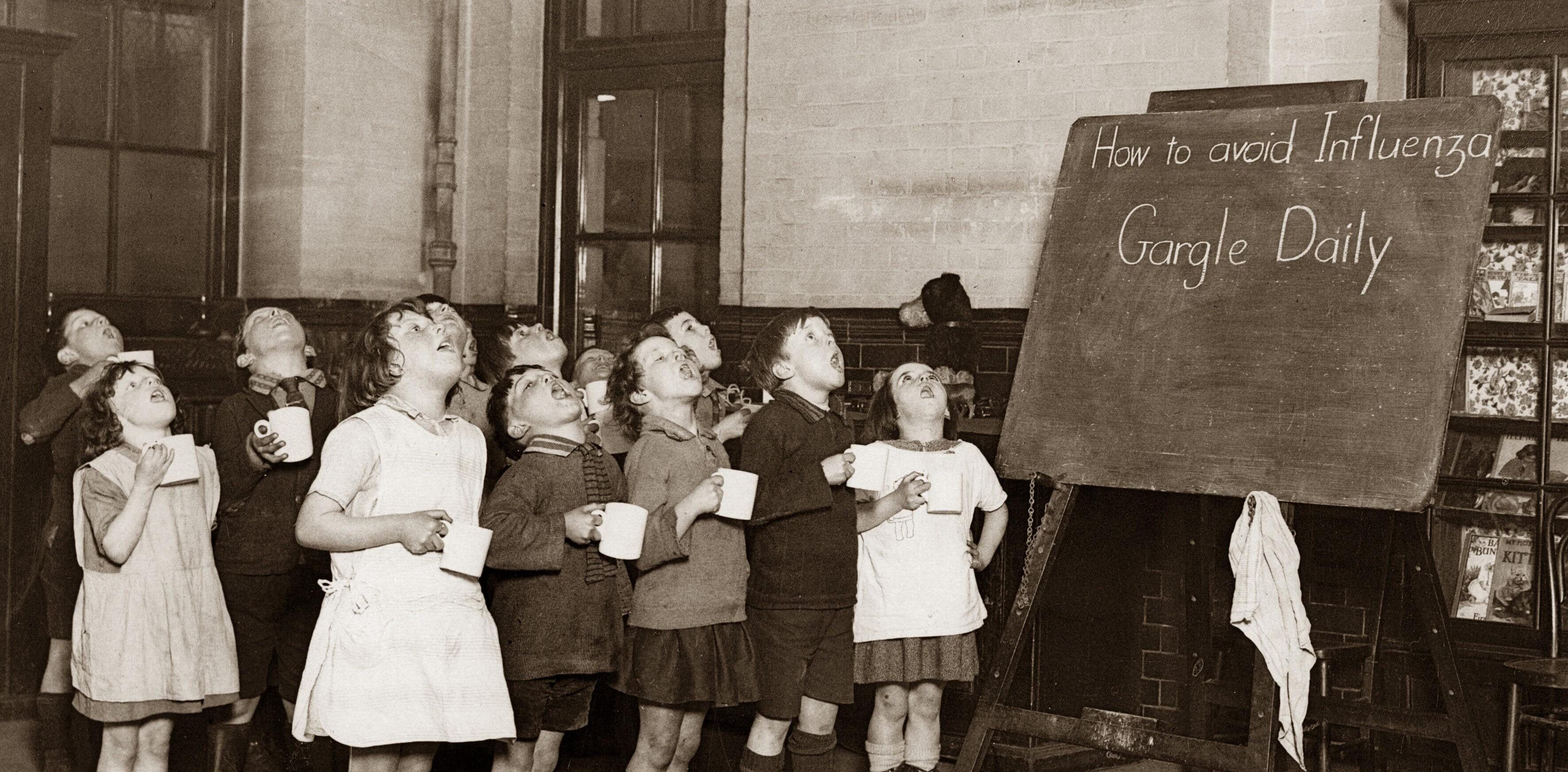 School children gargling their throats as a precaution against the Influenza epidemic, England