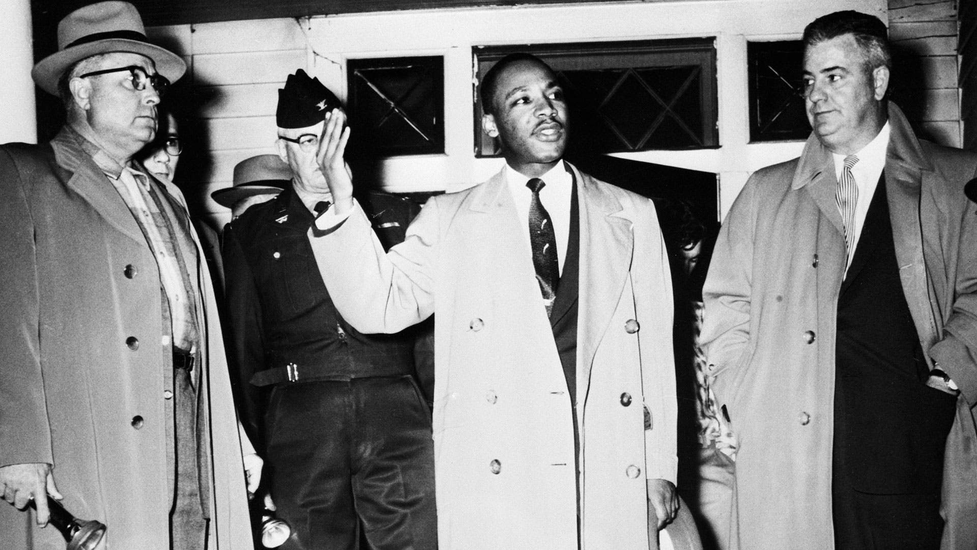 The Rev. Martin Luther King Jr. addresses a crowd from his front porch, at his home in Montgomery, Ala., on Jan. 30, 1956, after it was bombed.