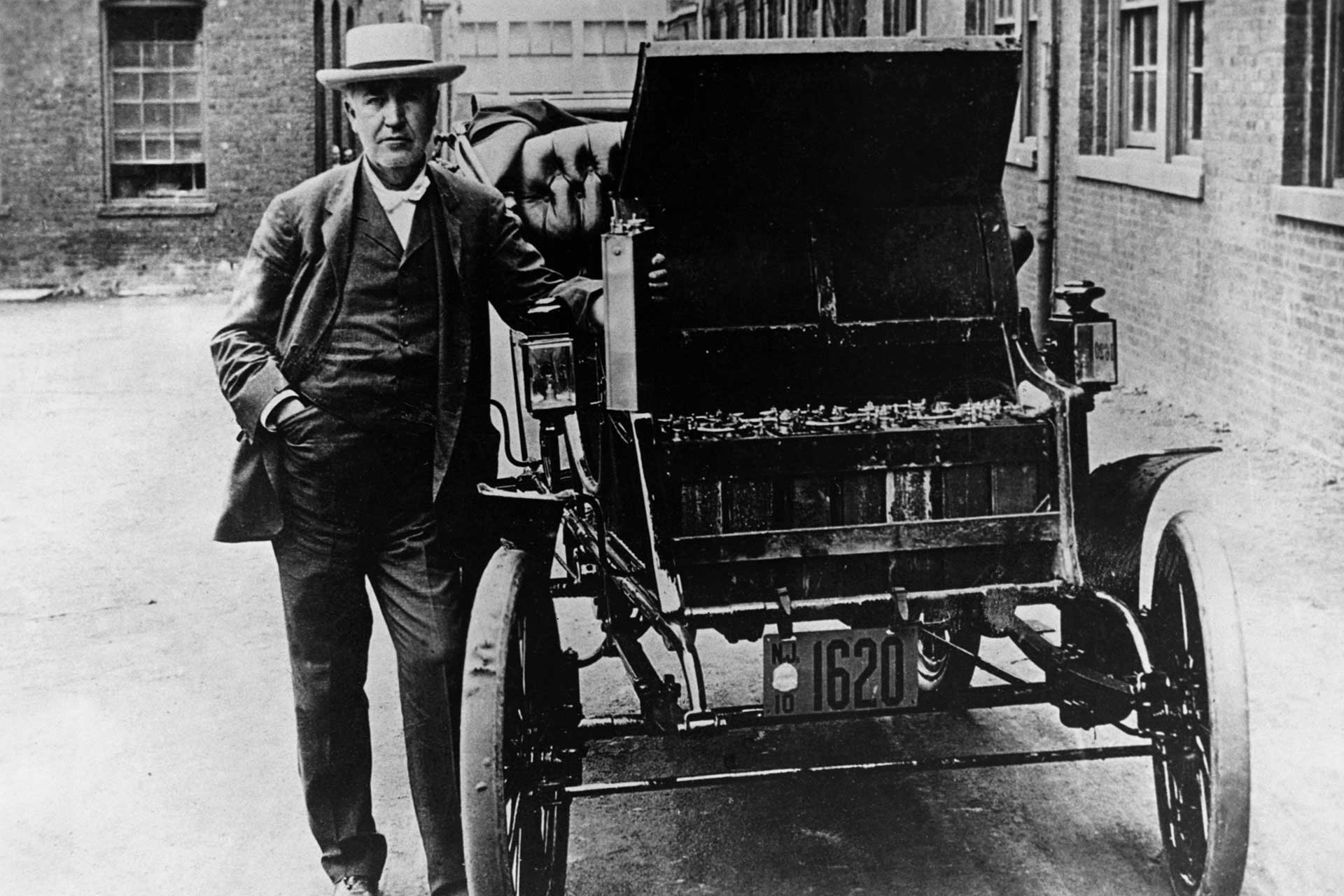 Thomas A. Edison stands next to his American Barker electric car, circa 1895.