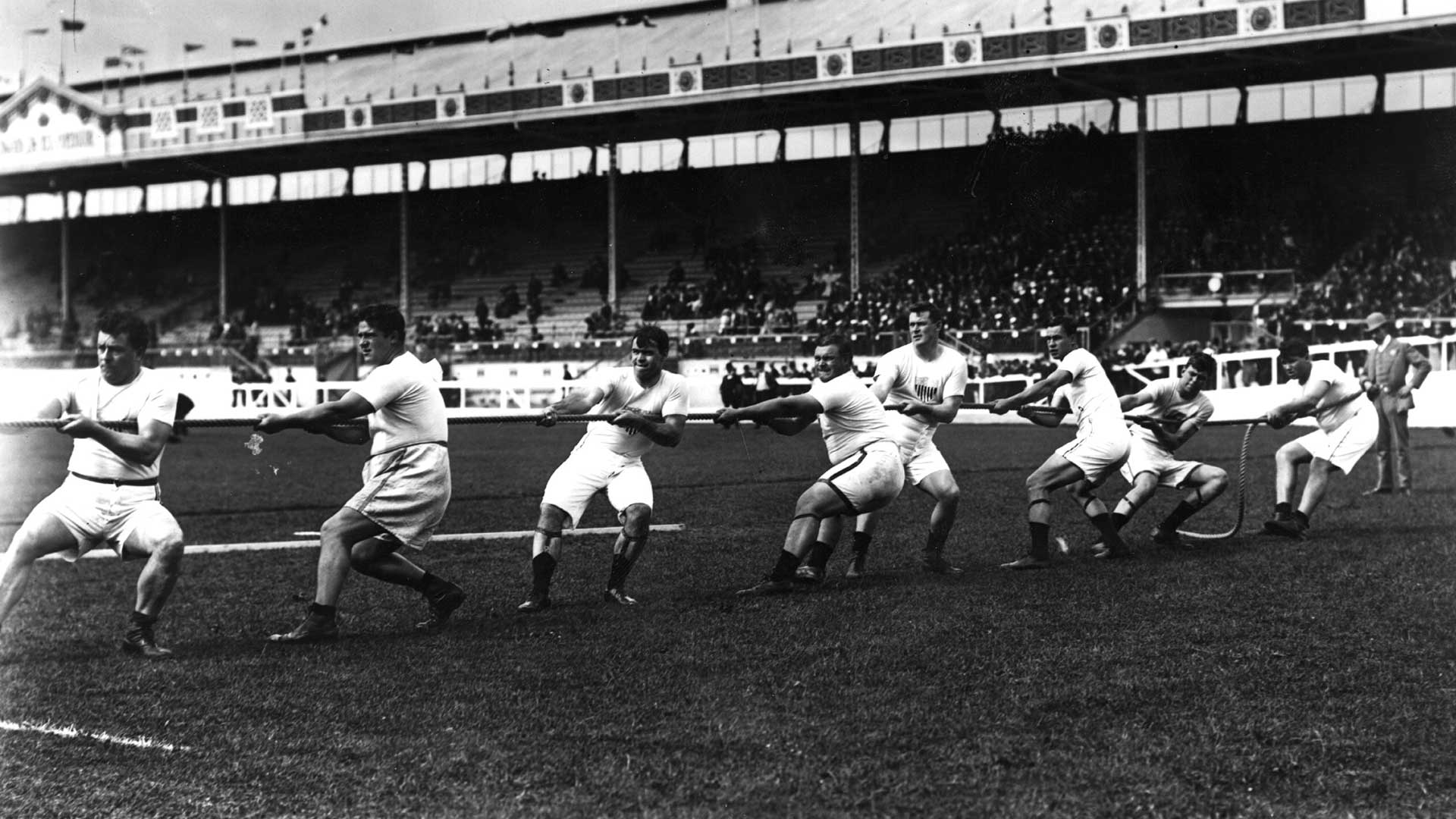 The U.S. tug-of-war team in action during the 1908 London Olympics.