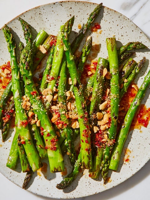 Blistered asparagus on a plate.