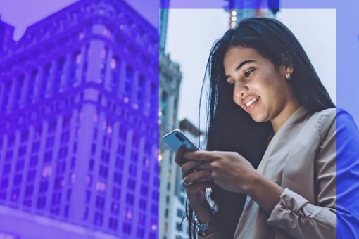 Woman using her phone and smiling