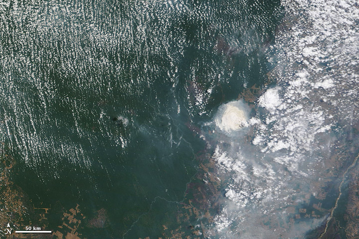 Satellite image of cloud and smoke interactions in the Brazilian Amazon.