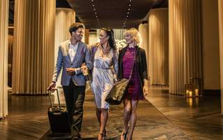 Group walking through the lobby of the Delano