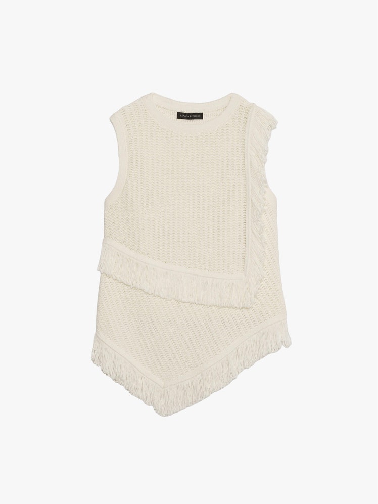 Image may contain Blouse Clothing Vest and Undershirt