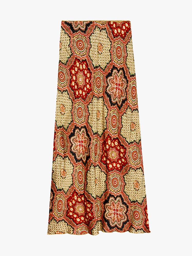 Image may contain Clothing Skirt Home Decor Pattern and Rug