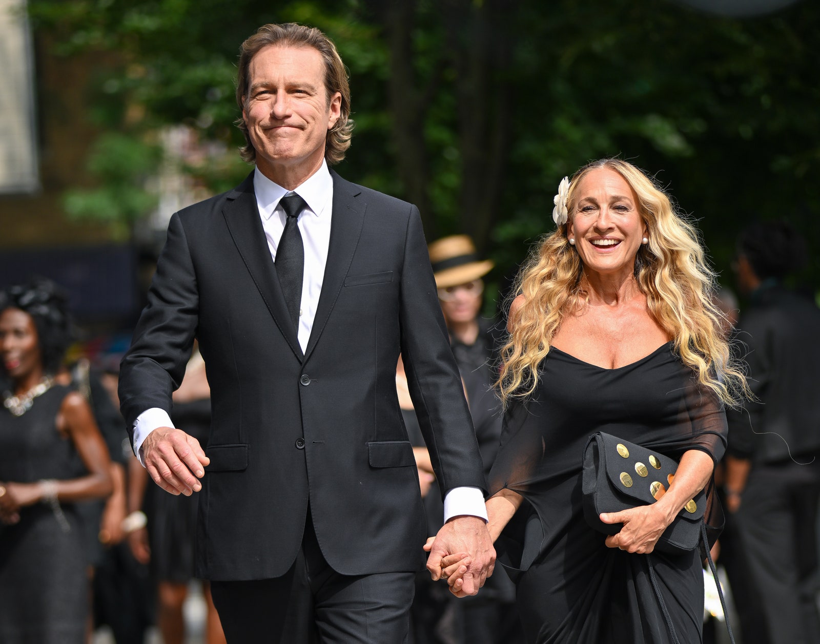 Image may contain John Corbett Sarah Jessica Parker Accessories Formal Wear Tie Body Part Hand Person Adult and Bag