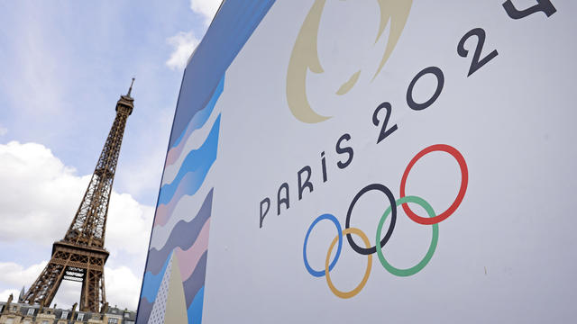 Paris 2024 Olympics logo with the Eiffel Tower in the background 