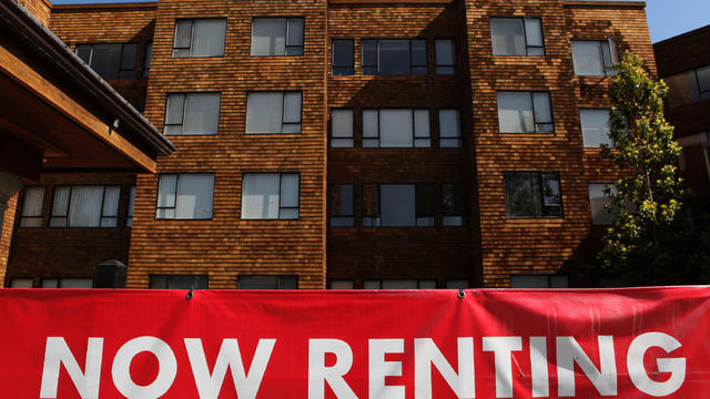 For rent sign in front of house 