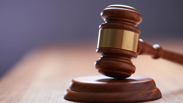 Selective focus on gavel hammer on wooden table top with copy space,Malaysia 