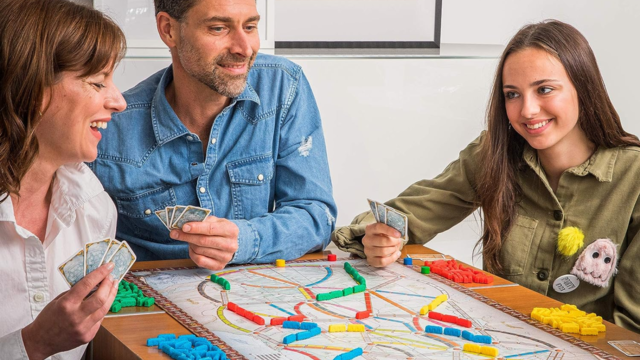 Family playing Ticket to Ride 