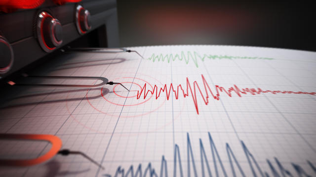 Seismograph printing seismic activity records of a severe earthquake 