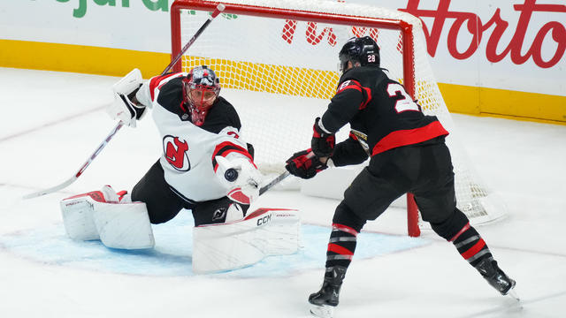 laude Giroux #28 of the Ottawa Senators battles for puck possession against Jacob Markstrom #25 of the New Jersey Devils during the first period at Canadian Tire Centre on October 17, 2024 in Ottawa, Ontario, Canada. 