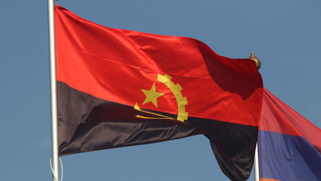 The national flag of the Republic of Angola, fluttering in 