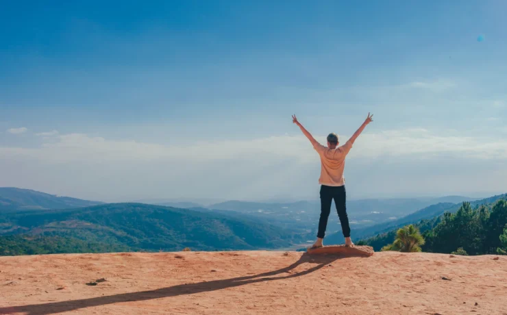 Person outside with happy arms