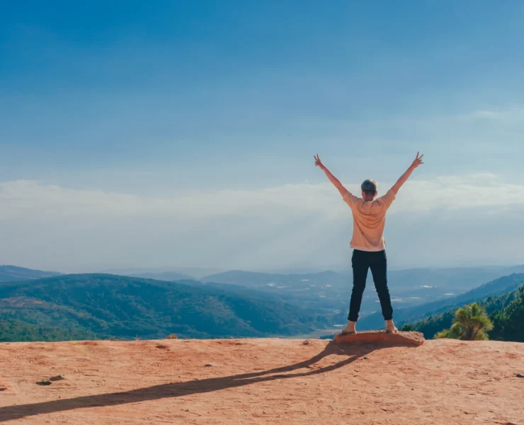 Person outside with happy arms