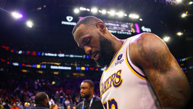 Feb 25, 2024; Phoenix, Arizona, USA; Los Angeles Lakers forward LeBron James (23) reacts as he walks off the court against the Phoenix Suns at Footprint Center.