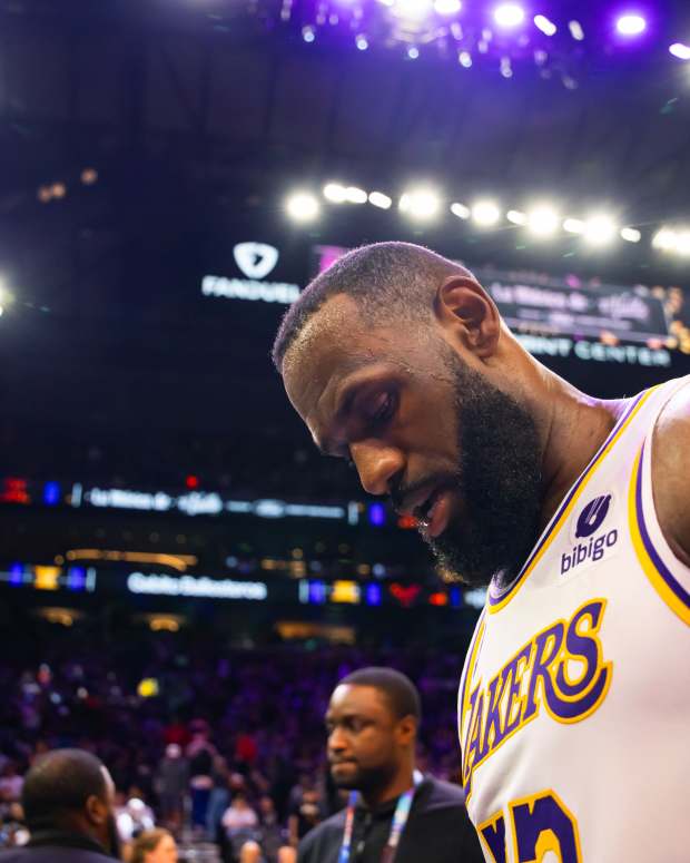 Feb 25, 2024; Phoenix, Arizona, USA; Los Angeles Lakers forward LeBron James (23) reacts as he walks off the court against the Phoenix Suns at Footprint Center.