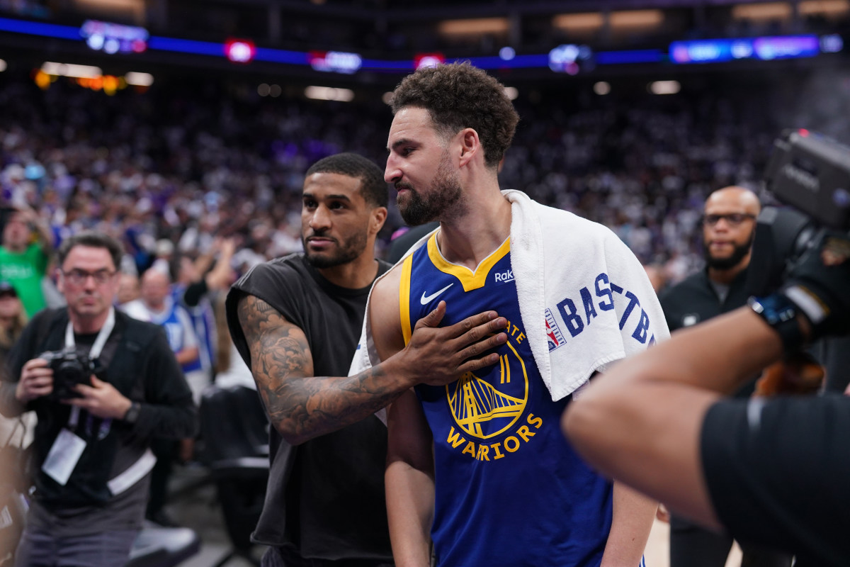 Golden State Warriors guard Klay Thompson and guard Gary Payton II walk toward the locker room after their team lost to the Sacramento Kings during a play-in game of the 2024 NBA playoffs at the Golden 1 Center on April 16.