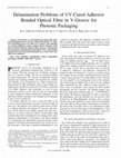 Research paper thumbnail of Delamination problems of UV-cured adhesive bonded optical fiber in V-groove for photonic packaging