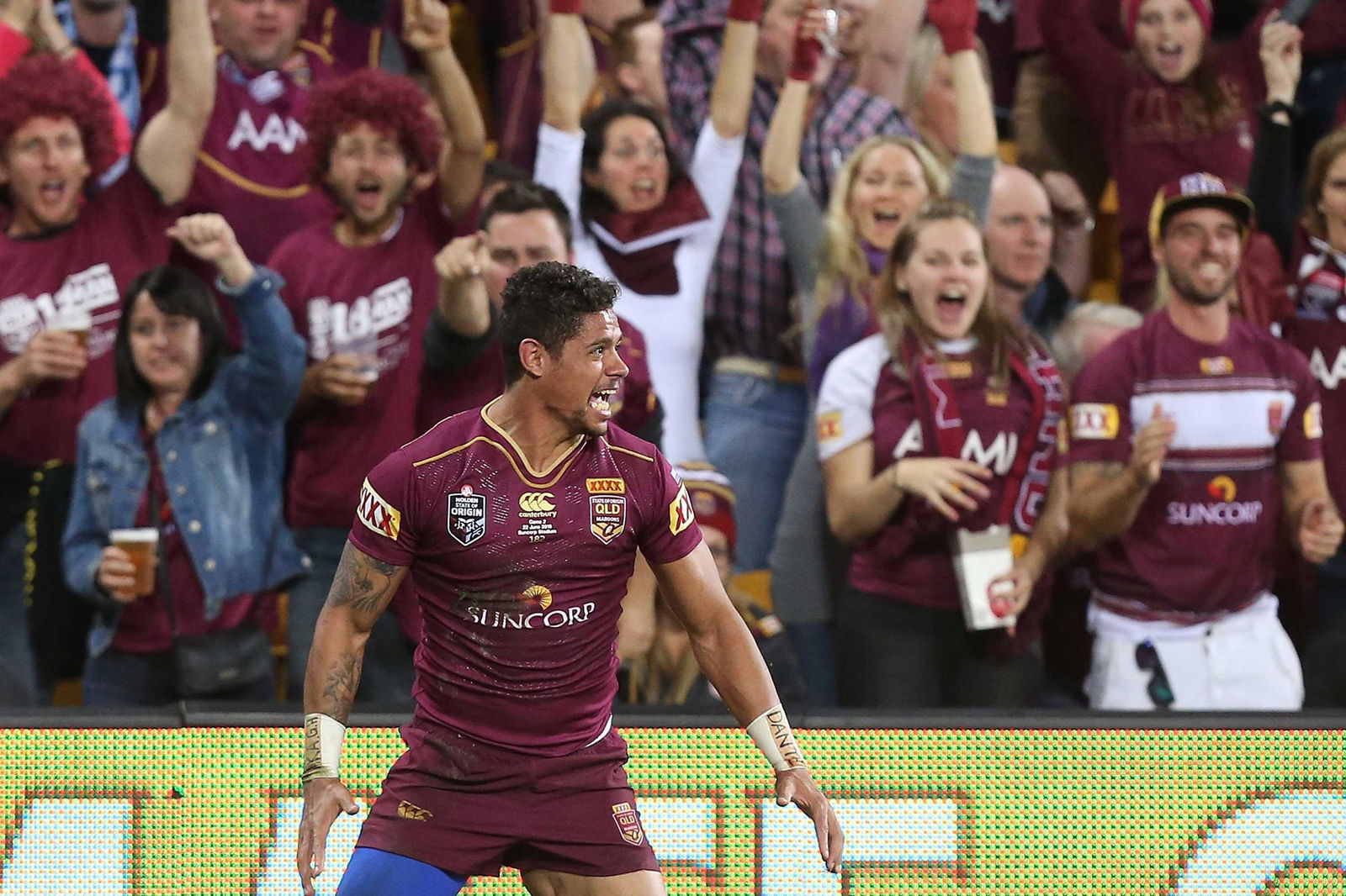 Dane Gagai stands in front of fans in State of Origin.