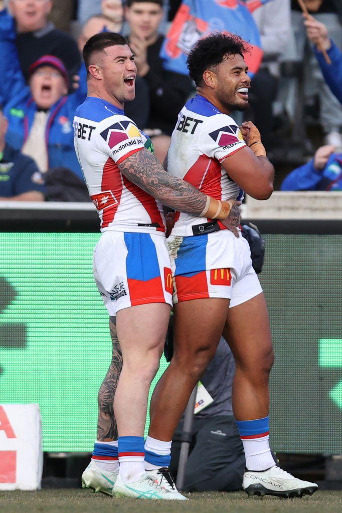 Bradman Best and Greg Marzhew celebrate a try.