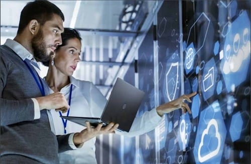 two people working in tech control room