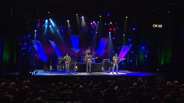 The Fab Four performing on stage