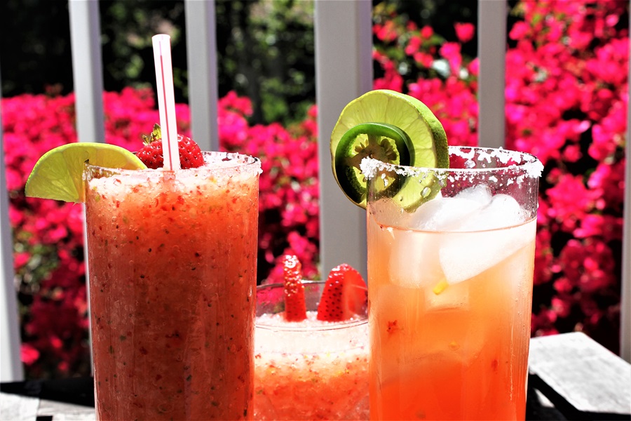 Strawberry Jalapeno Margarita Recipe on the Rocks Close Up of Two Margaritas on a Small Table Outdoors