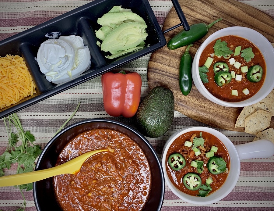 2B Mindset Instant Pot Chili Recipe Overhead View of Three Bowls of Chili with a Serving Tray of Other Toppings