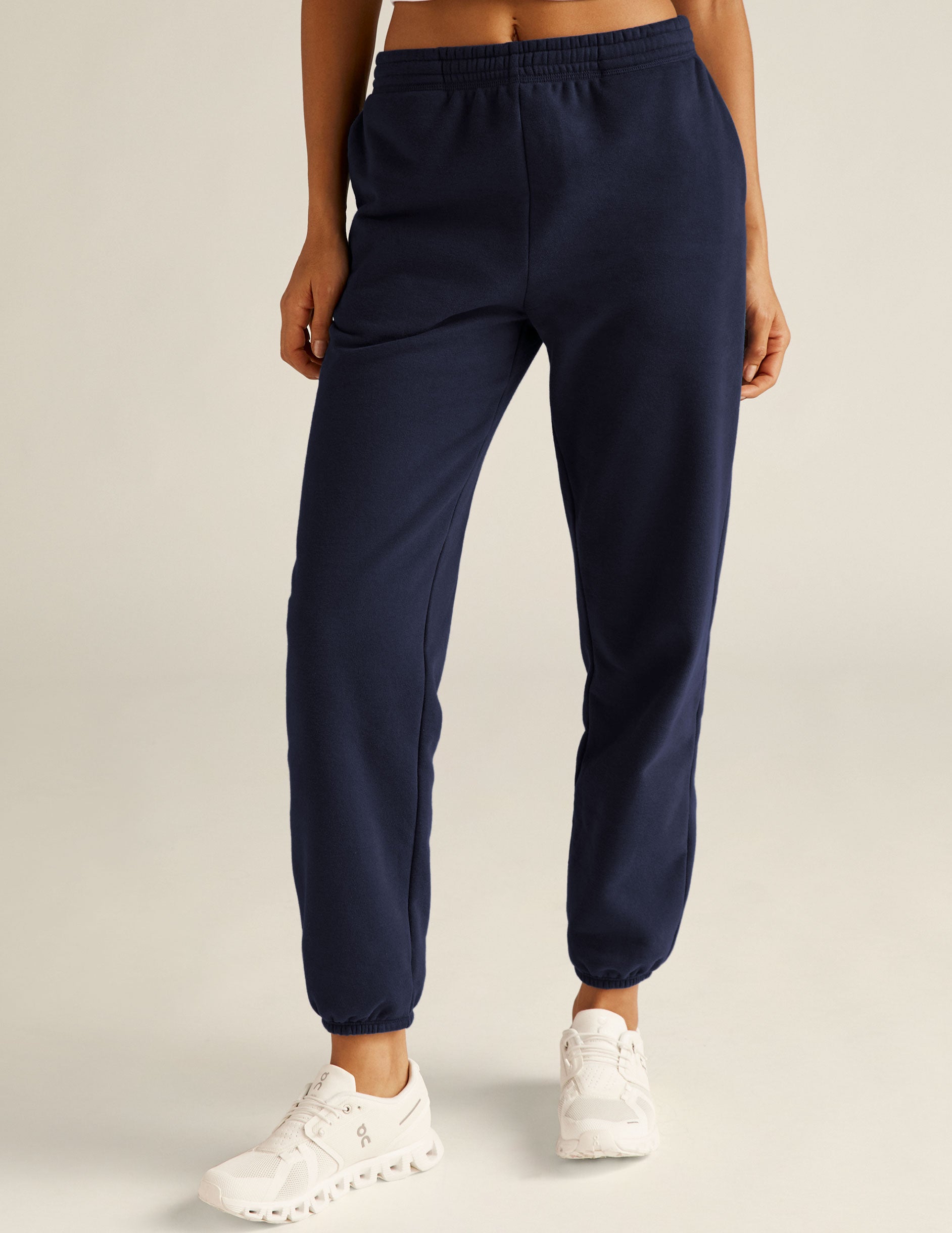 blue jogger style sweatpants with pockets. 