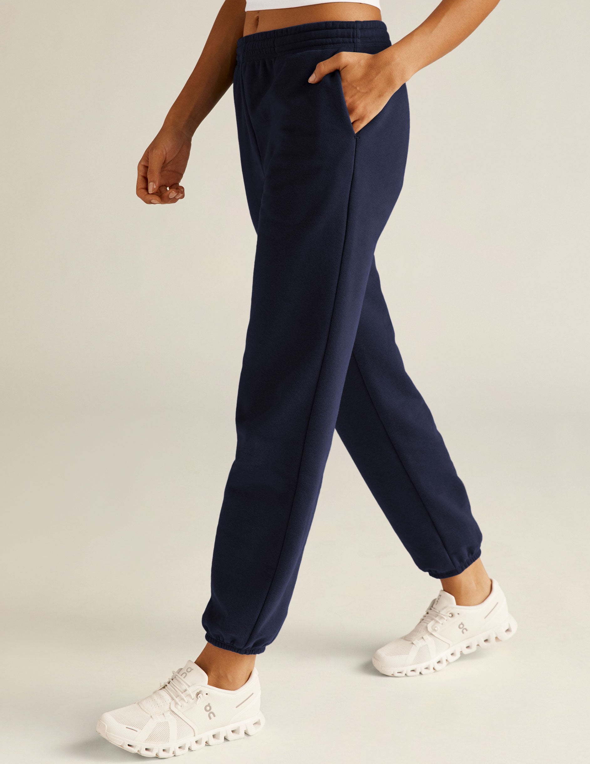 blue jogger style sweatpants with pockets. 