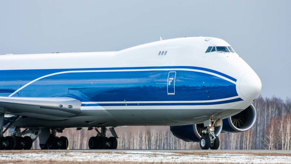 taxiing wide body cargo plane on runway