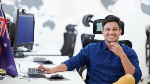 man sitting at desk in australia