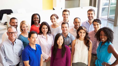 multicultural office staff standing