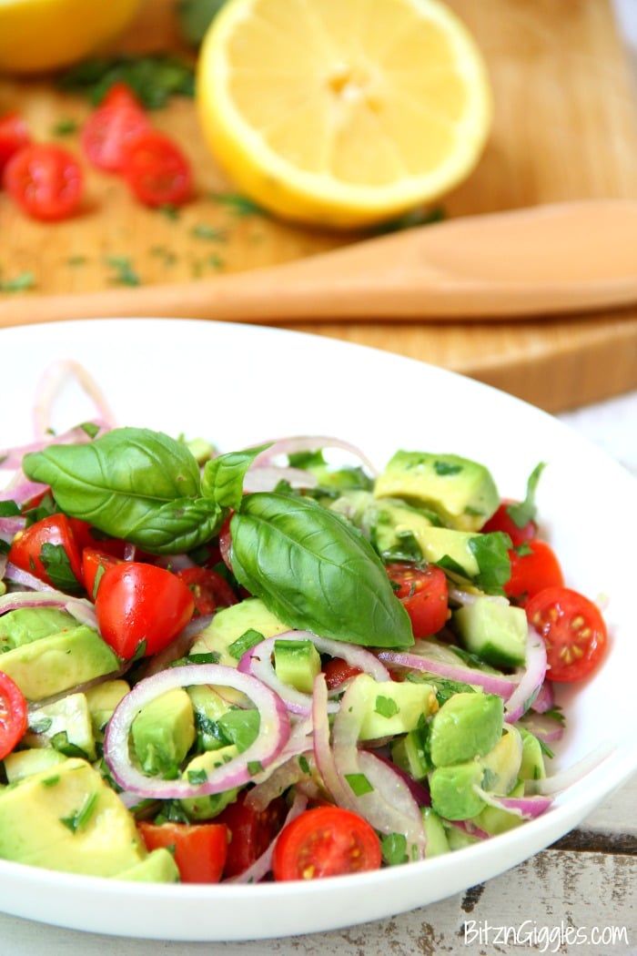 Avocado Salad - A healthy and colorful salad featuring avocado, tomato, cucumber, basil and a splash of lemon!