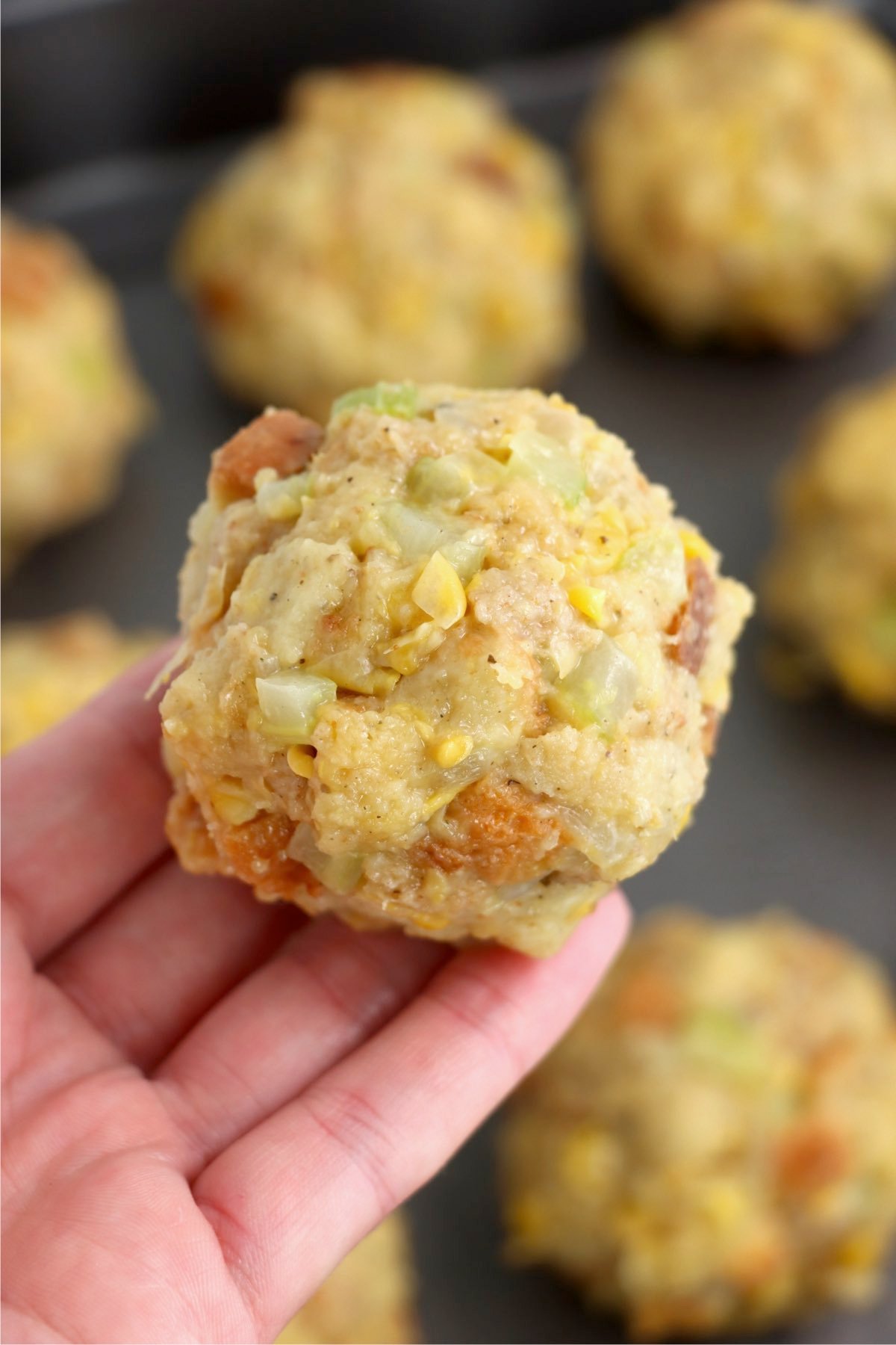 hand holding a ball of Thanksgiving stuffing