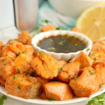 Marinated salmon bites cooked to perfection and served with a delicious dipping sauce.