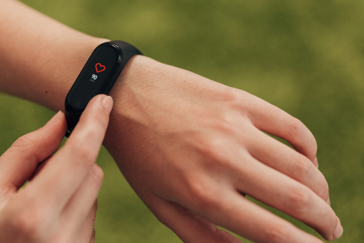 Girl Checking Her Heart Rate On Smart Watch After Fitness.