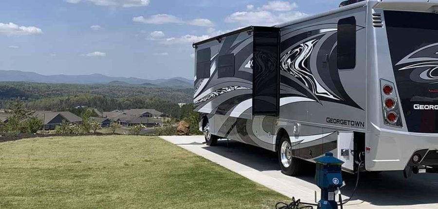 motorhome overlooking landscape of green hills.