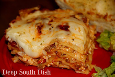 A classic, homestyle lasagna, made with a ground beef and Italian sausage, a homemade tomato based pasta sauce and layered in with lasagna noodles and cheeses.