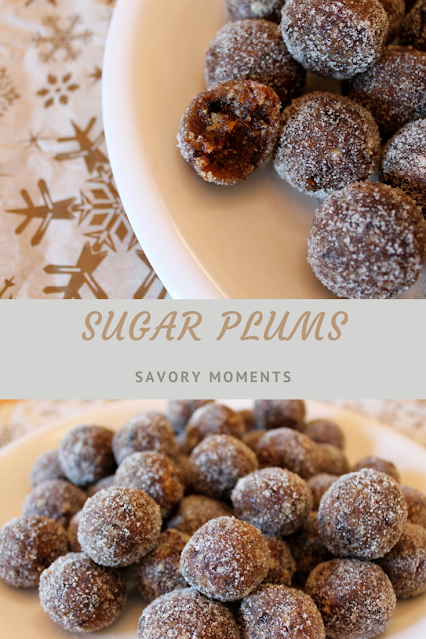 Finished sugar plums piled onto a white plate for serving.