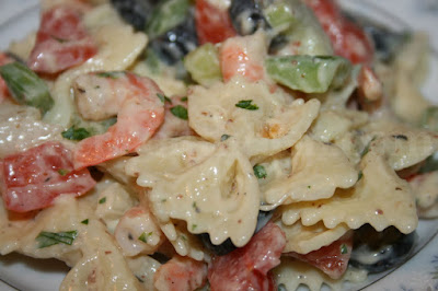 Bow tie pasta, onion, bell pepper, celery and black olives with seasoned boiled shrimp, dressed with a creamy mayonnaise and mustard vinegar dressing.