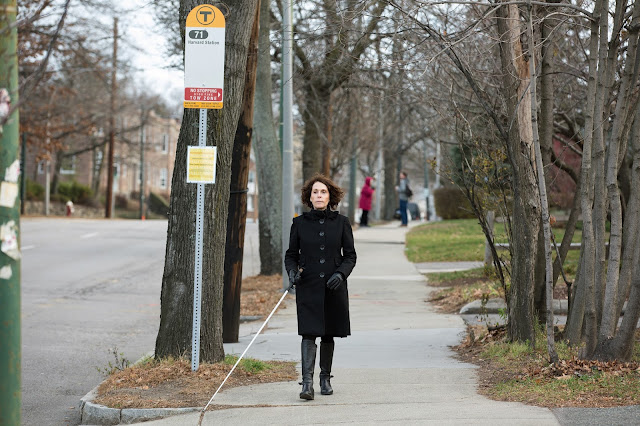 Joann Becker walking near bus stop