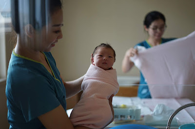 nurse and newborn