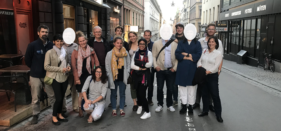 A group of people gathered for a photo outside 